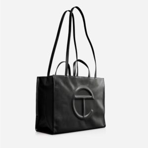 Telfar Black Large Ht 143/4", W191/4", D 7", Strap Drop 21", Handle Drop 51/2"